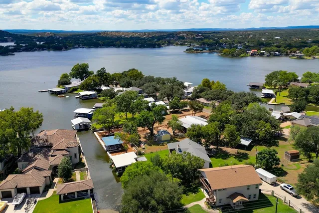 an aerial view of a houses with lake view