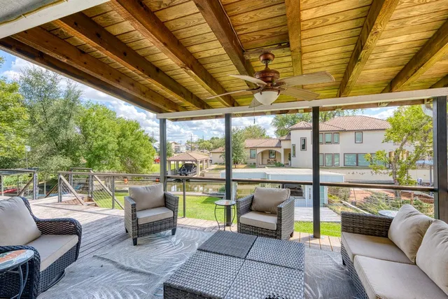 a balcony with furniture and a view of the back