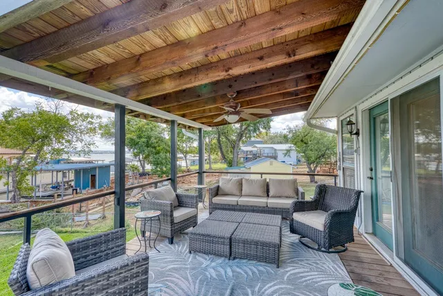 a balcony with furniture and a potted plant