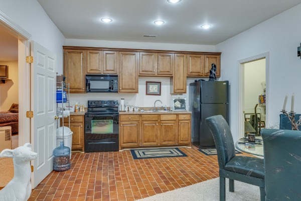 4664 New Cut Road Greenbrier, TN 37073 - Photo 15 of 85 a kitchen with a refrigerator and a stove top oven