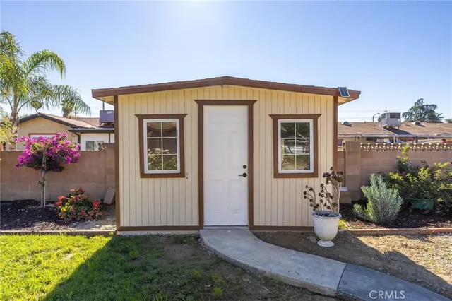 a view of a backyard with potted plants