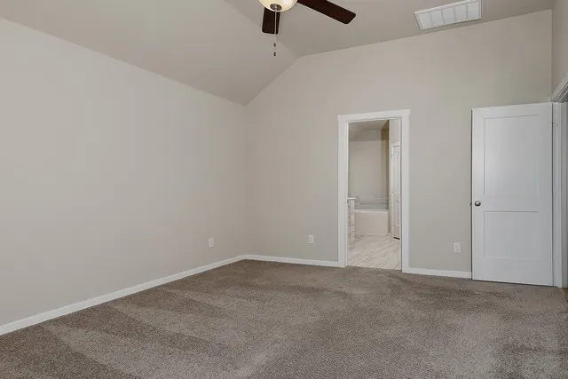 a bathroom with a shower and a glass door