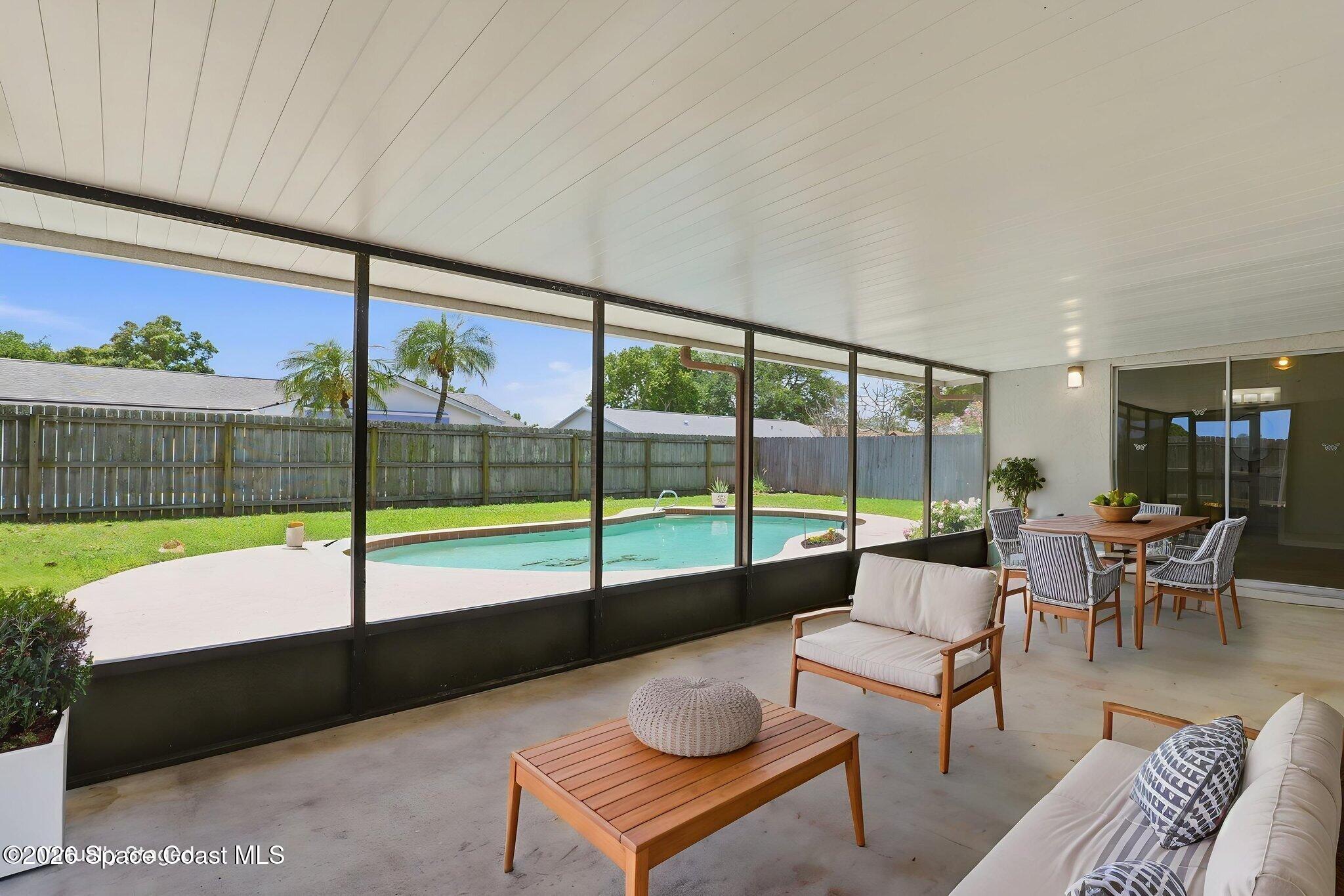 1971 Tallpalm Road Melbourne, FL 32935 - Photo 37 of 45 Screened Porch (Virtually Staged)