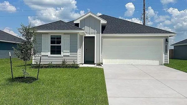 a view of a house with a backyard