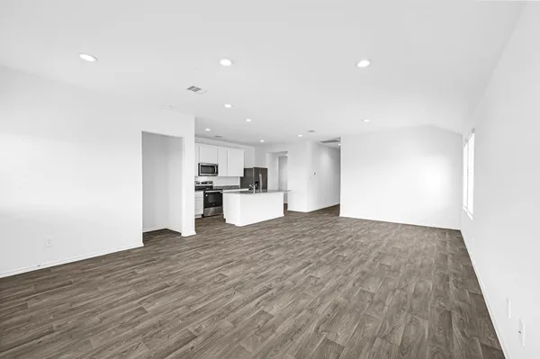 a view of kitchen with wooden floor