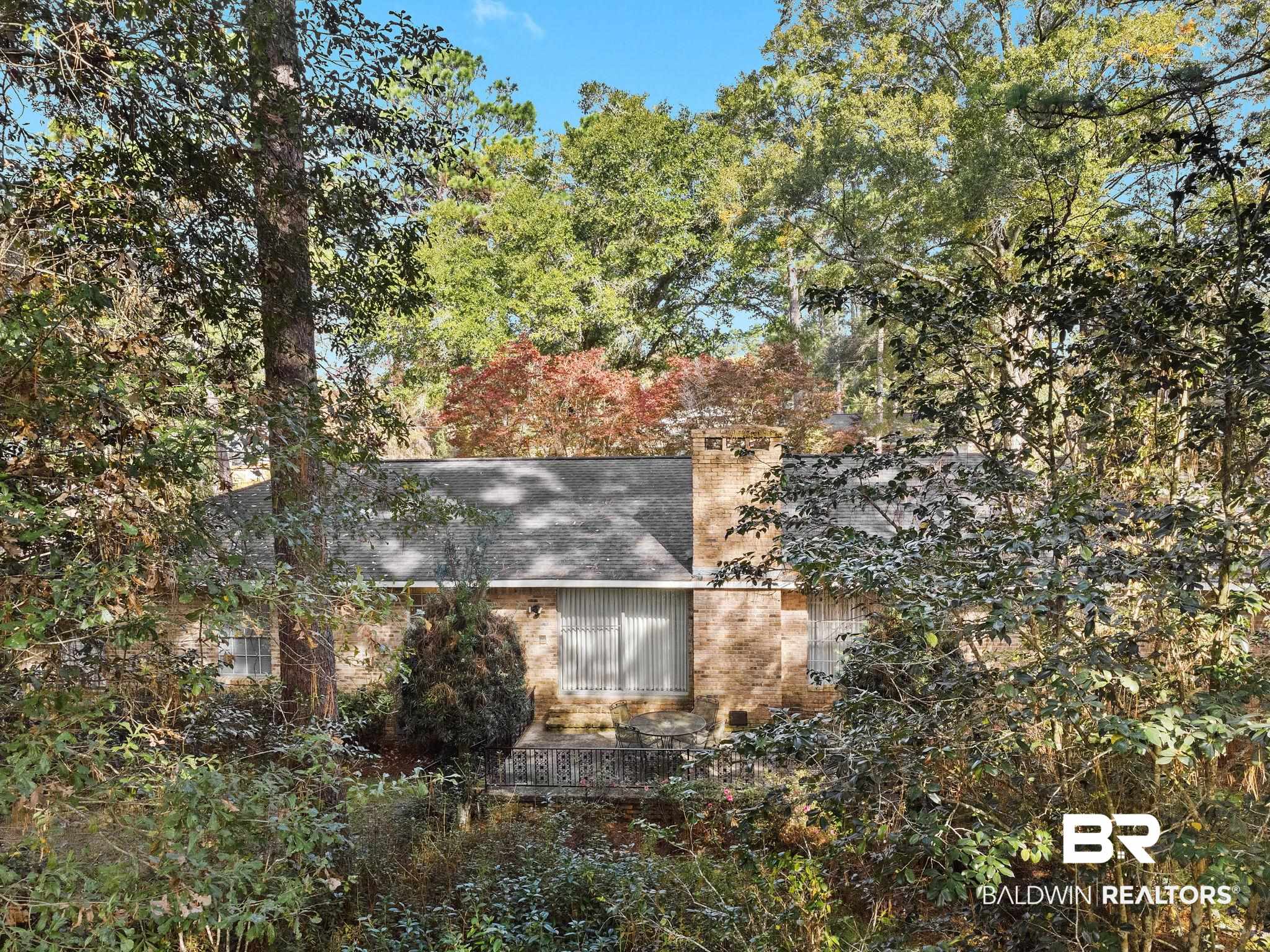 752 Evergreen Street Fairhope, AL 36532 - Photo 54 of 100 View of home's exterior with brick siding and a chimney