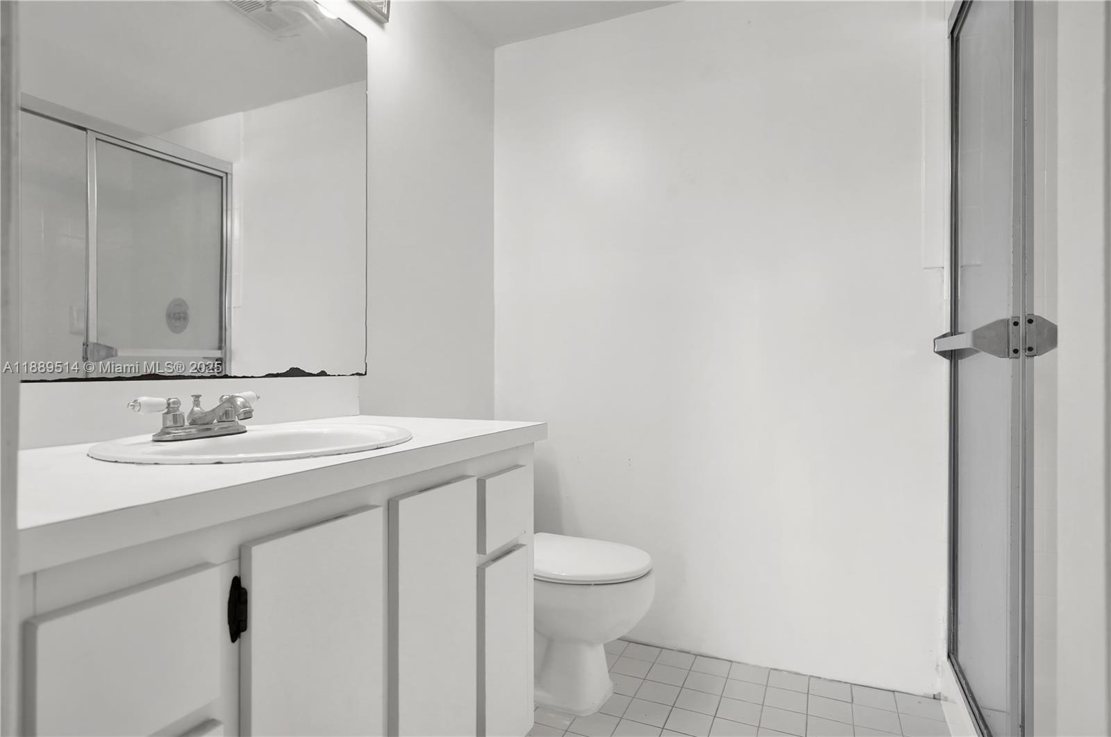 860 Northeast 207th Terrace, Unit 8106 Miami, FL 33179 - Photo 14 of 24 a bathroom with a sink and a toilet