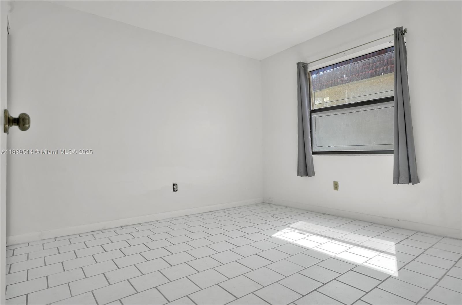 860 Northeast 207th Terrace, Unit 8106 Miami, FL 33179 - Photo 20 of 24 a view of room with window