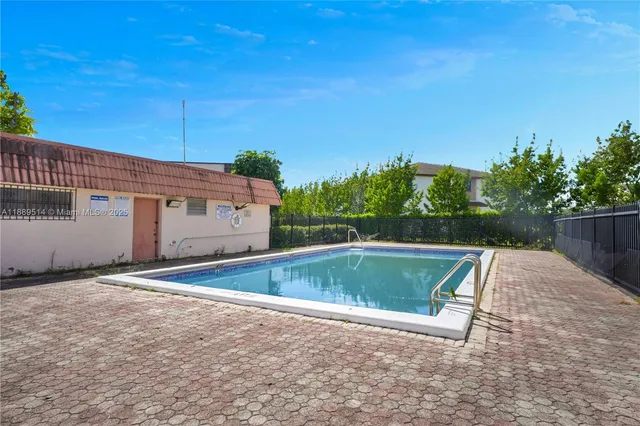 a view of outdoor space with swimming pool