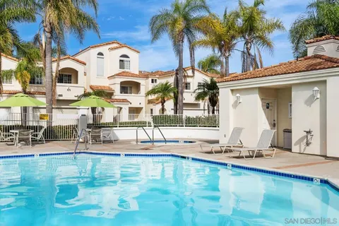 a view of a swimming pool with a lounge chair