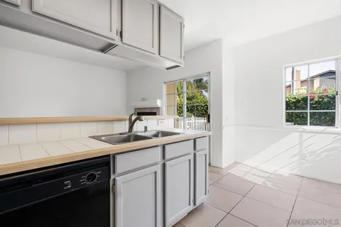 a kitchen with a sink and cabinets
