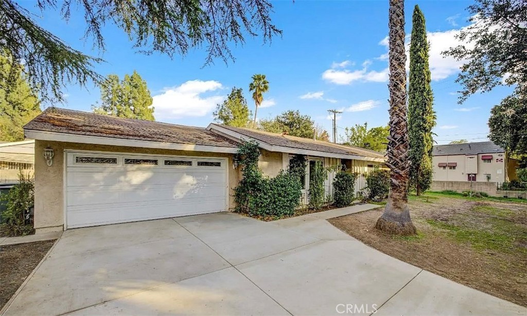 1202 Sunset Avenue Pasadena, CA 91103 - Photo 1 of 1 a front view of a house with a yard and garage
