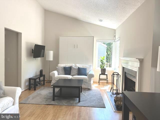 11743 Summerchase Circle, Unit B Reston, VA 20194 - Photo 24 of 25 Open floor plan LR - FP, no carpet throughout