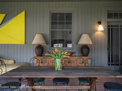 a view of a dining room with furniture window and outside view