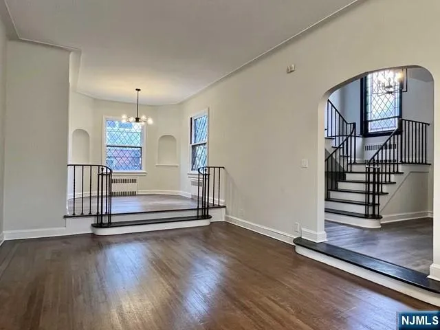 a view of entryway with stairs and wooden floor