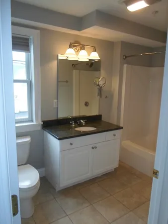 a bathroom with a sink a toilet and a bathtub