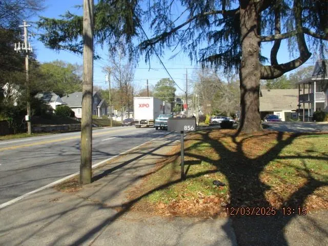 a view of a park with large trees