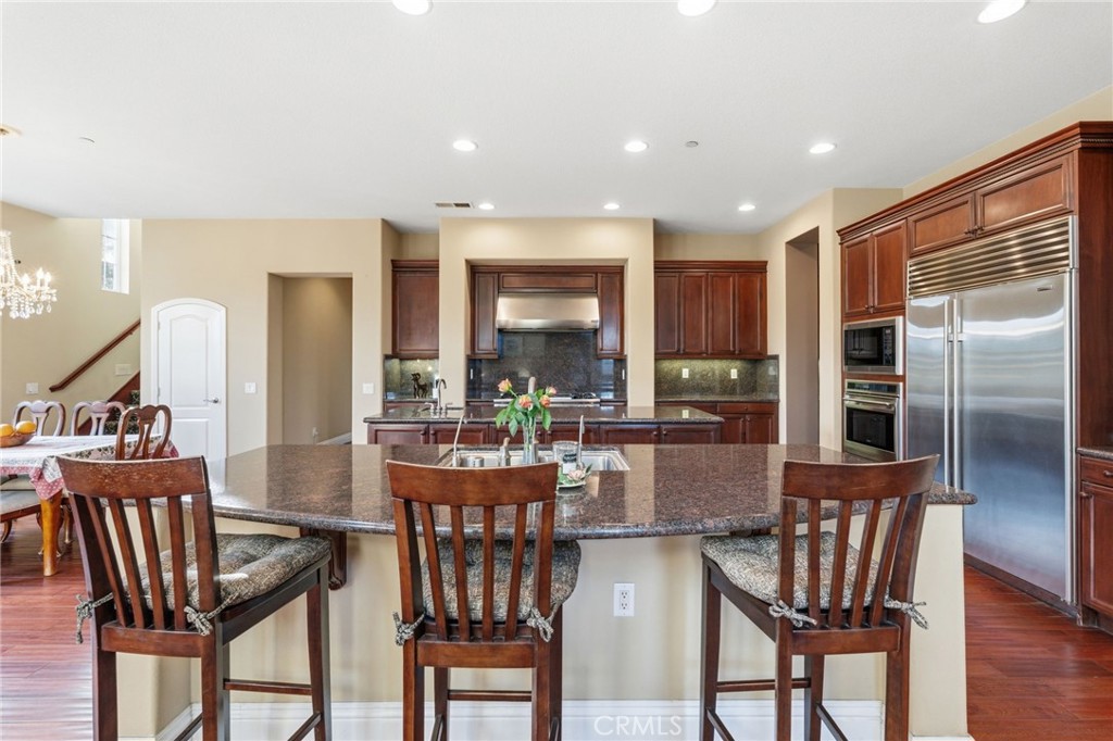 4463 Cardinal Cushing Claremont, CA 91711 - Photo 17 of 75 a view of a dining room with furniture window and wooden floor
