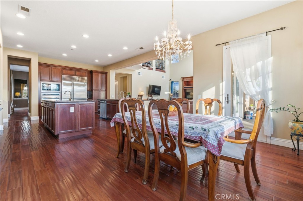 4463 Cardinal Cushing Claremont, CA 91711 - Photo 22 of 75 a view of a dining room with furniture window and wooden floor