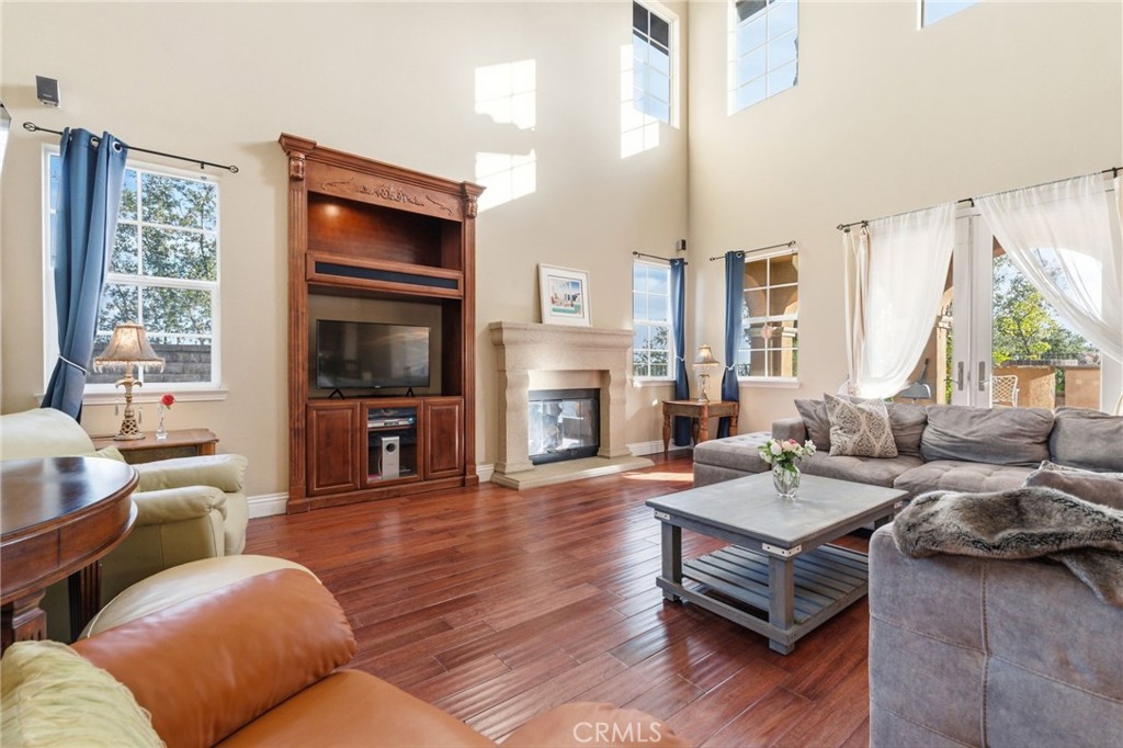 4463 Cardinal Cushing Claremont, CA 91711 - Photo 26 of 75 a living room with fireplace furniture and a flat screen tv