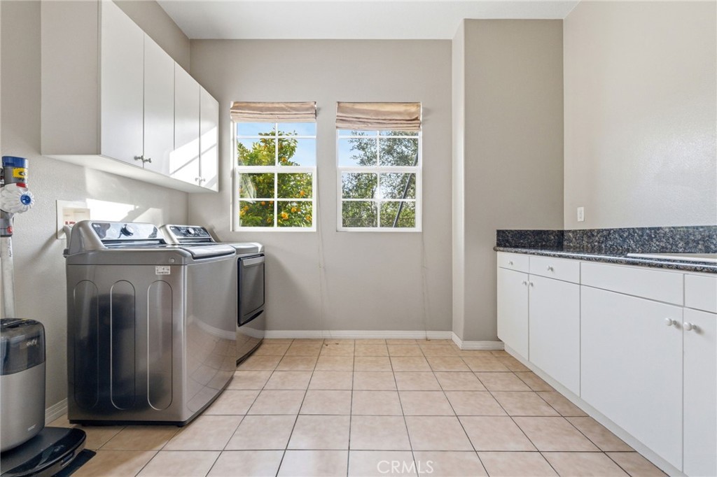 4463 Cardinal Cushing Claremont, CA 91711 - Photo 29 of 75 a utility room with a sink a washer and dryer
