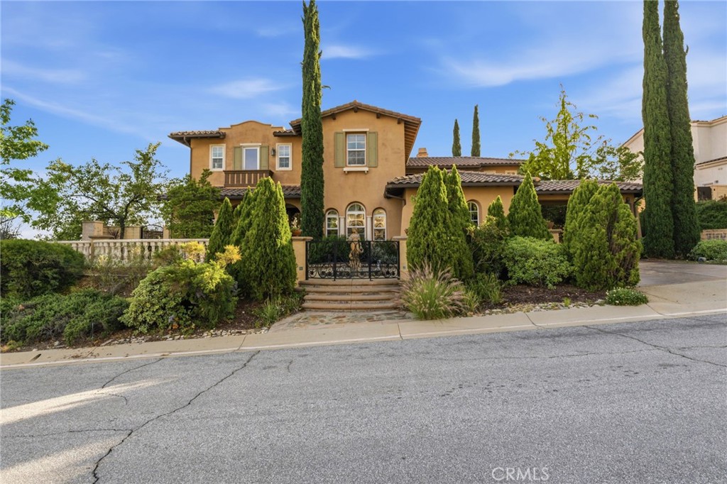 4463 Cardinal Cushing Claremont, CA 91711 - Photo 3 of 75 a front view of a house with a yard and potted plants