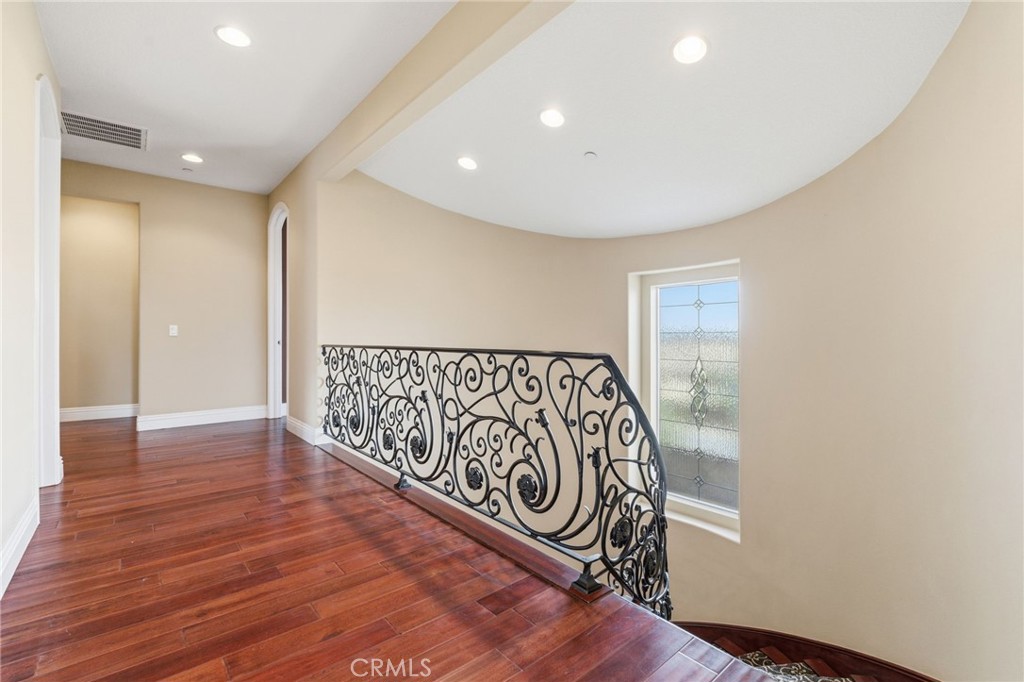 4463 Cardinal Cushing Claremont, CA 91711 - Photo 33 of 75 a view of a hallway with wooden floor