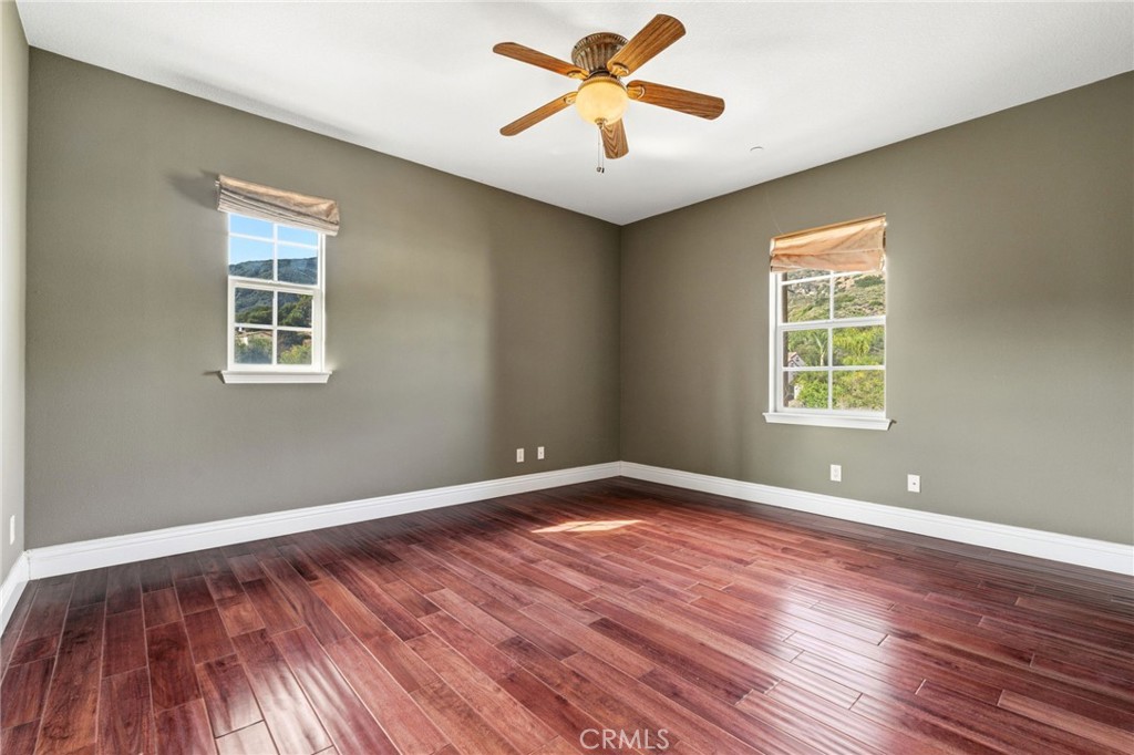 4463 Cardinal Cushing Claremont, CA 91711 - Photo 34 of 75 a view of empty room with wooden floor and fan