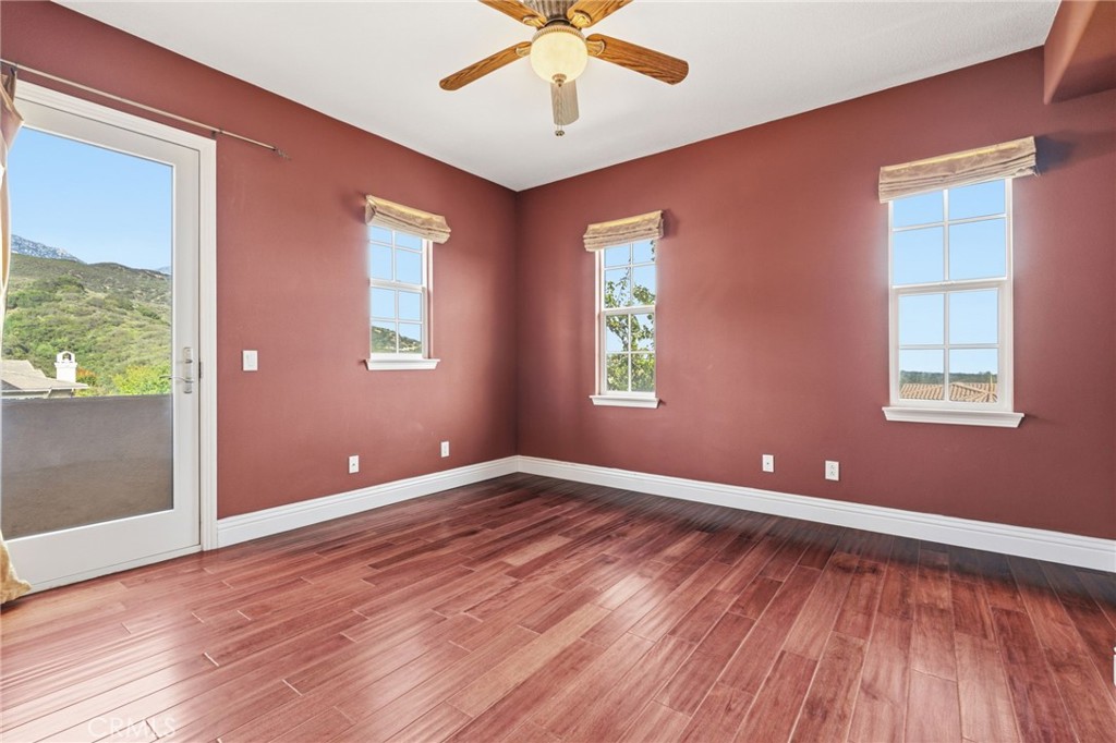 4463 Cardinal Cushing Claremont, CA 91711 - Photo 39 of 75 an empty room with wooden floor and windows