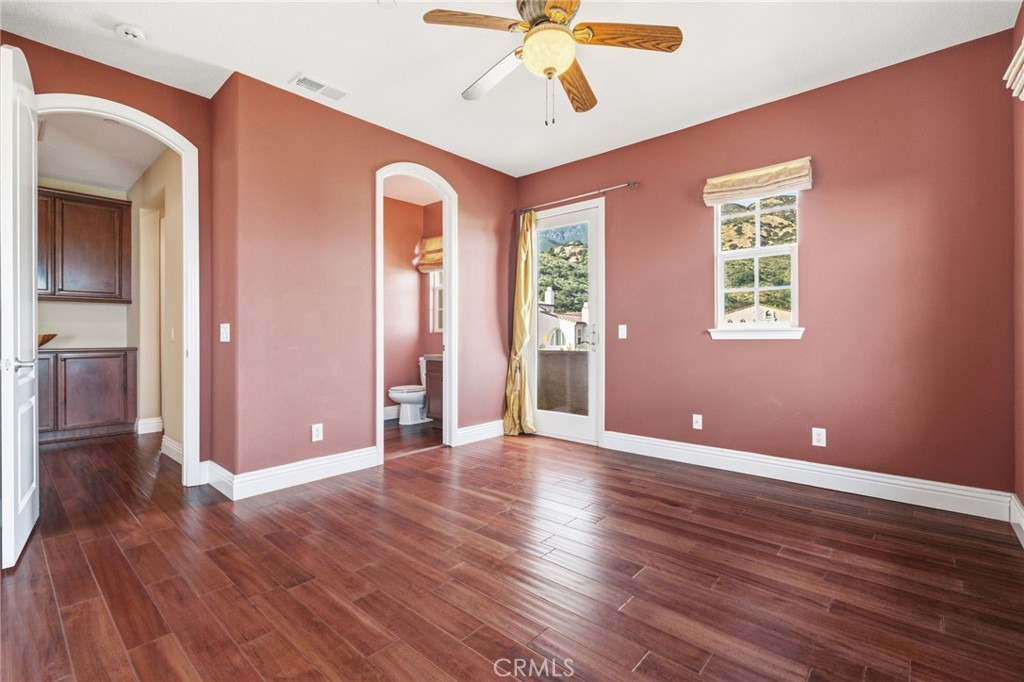 4463 Cardinal Cushing Claremont, CA 91711 - Photo 41 of 75 a view of an empty room with wooden floor and a window