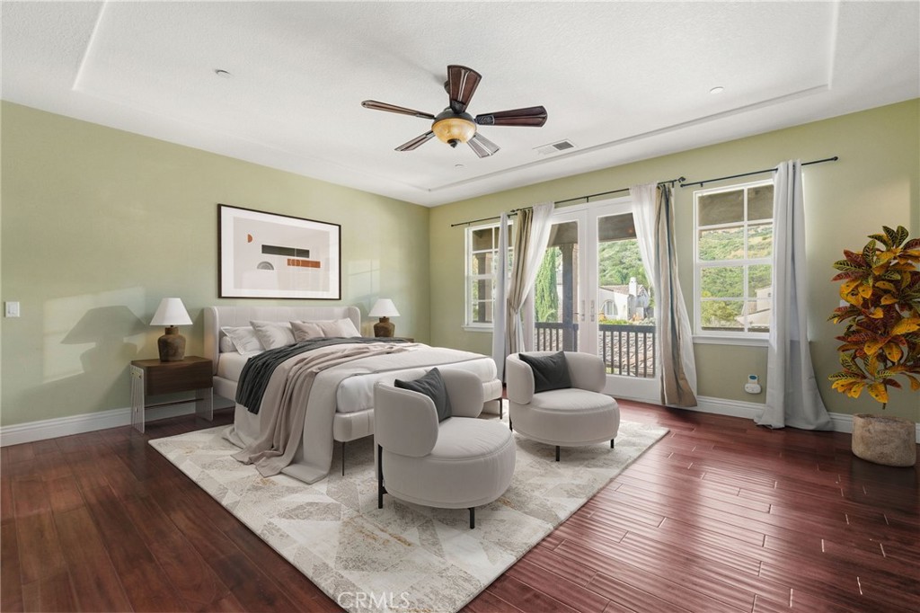 4463 Cardinal Cushing Claremont, CA 91711 - Photo 51 of 75 a spacious bedroom with a bed and wooden floor
