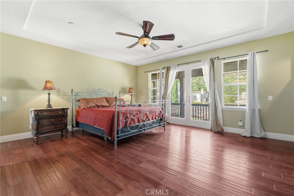 4463 Cardinal Cushing Claremont, CA 91711 - Photo 52 of 75 a bedroom with a bed and wooden floor