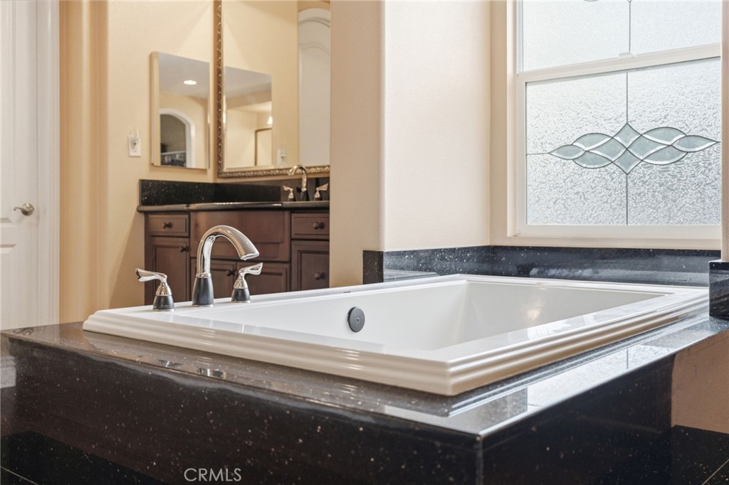 4463 Cardinal Cushing Claremont, CA 91711 - Photo 59 of 75 a bathroom with a bathtub and a sink