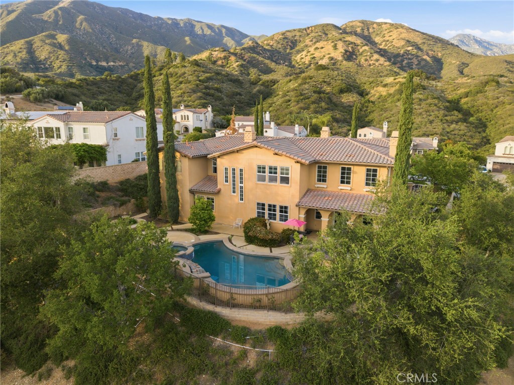 4463 Cardinal Cushing Claremont, CA 91711 - Photo 68 of 75 a front view of a house with a yard and lake view