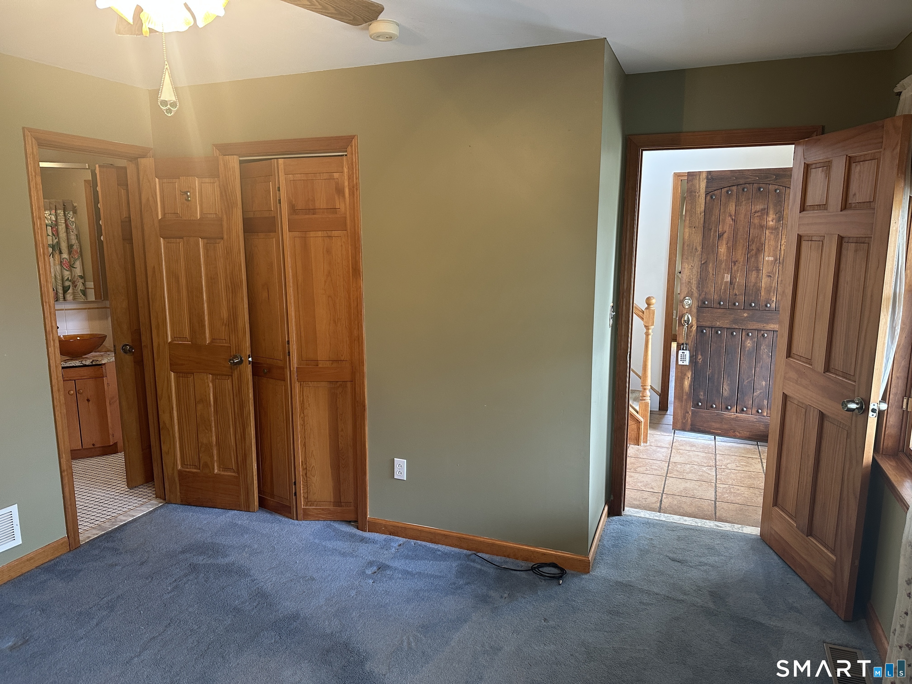 181 North Chestnut Hill Road Killingworth, CT 06419 - Photo 11 of 26 a view of a hallway with wooden shelves