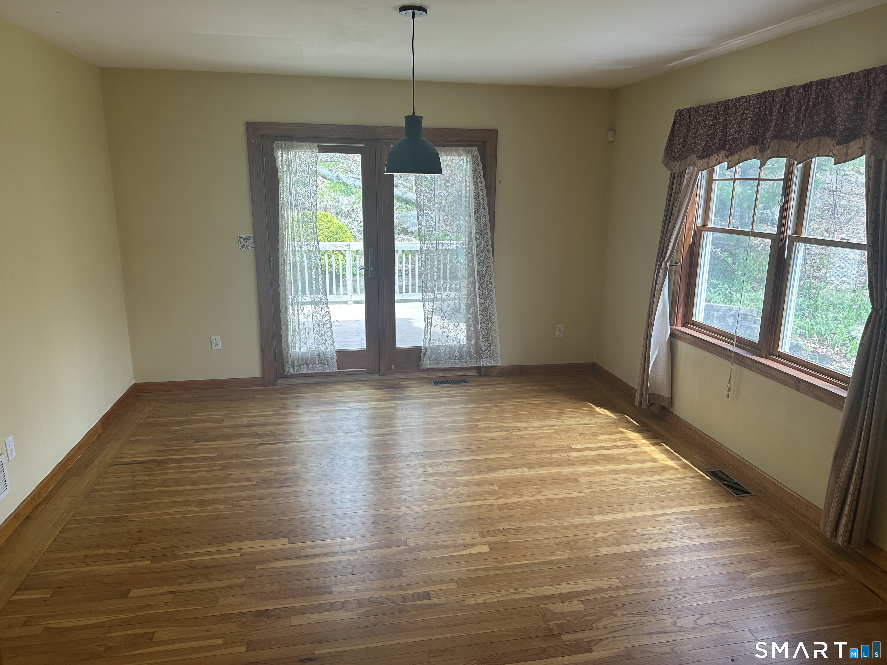 181 North Chestnut Hill Road Killingworth, CT 06419 - Photo 15 of 26 a view of an empty room with wooden floor and a window