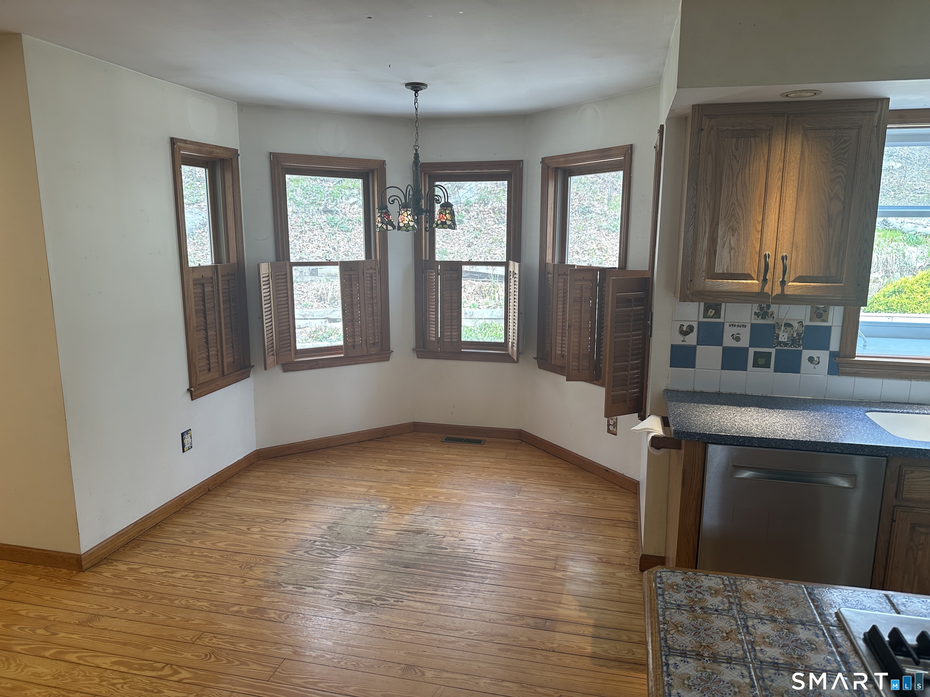 181 North Chestnut Hill Road Killingworth, CT 06419 - Photo 17 of 26 a view of an empty room with a window and wooden floor