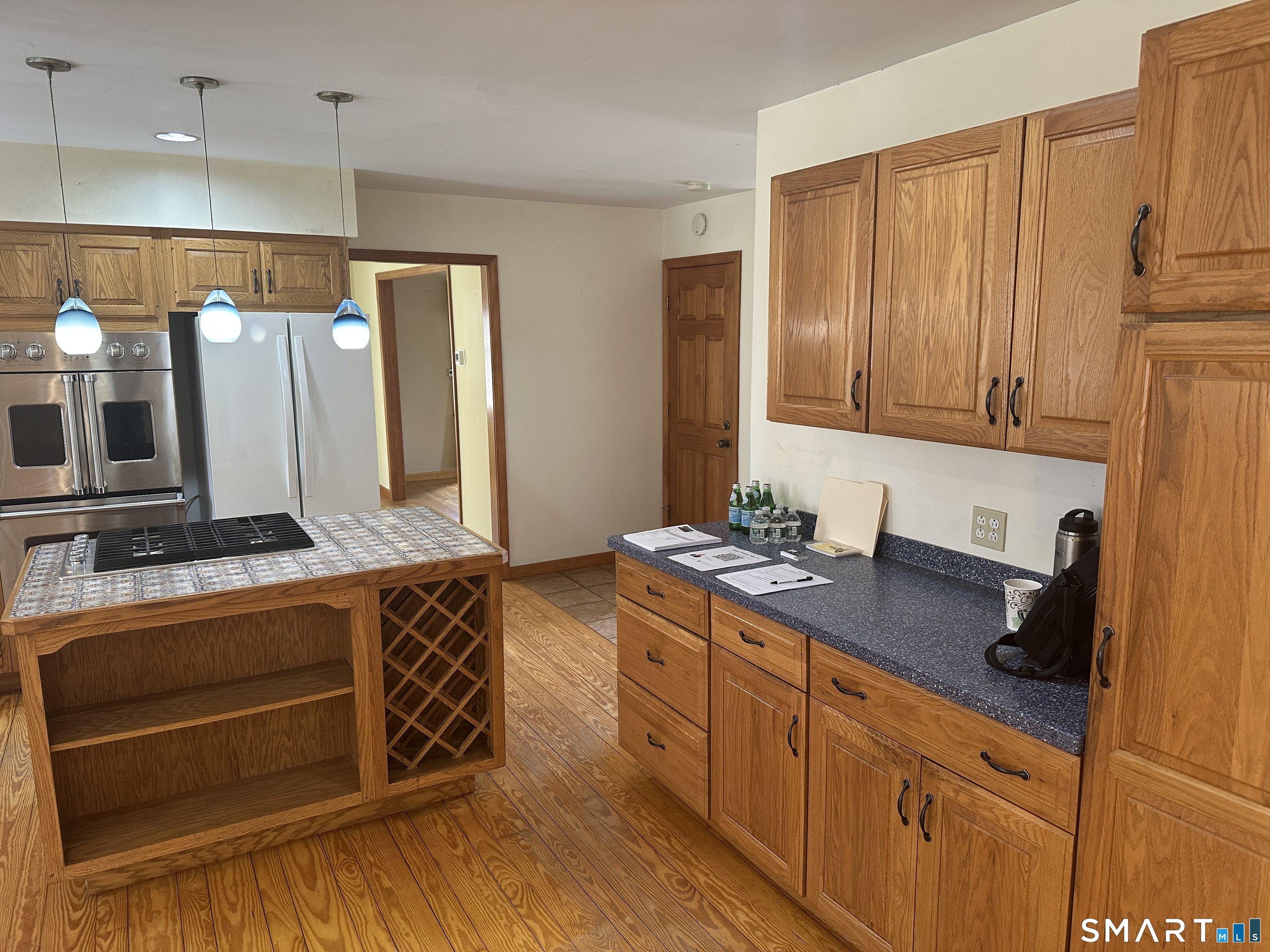 181 North Chestnut Hill Road Killingworth, CT 06419 - Photo 19 of 26 a kitchen with stainless steel appliances granite countertop a stove a sink and a refrigerator