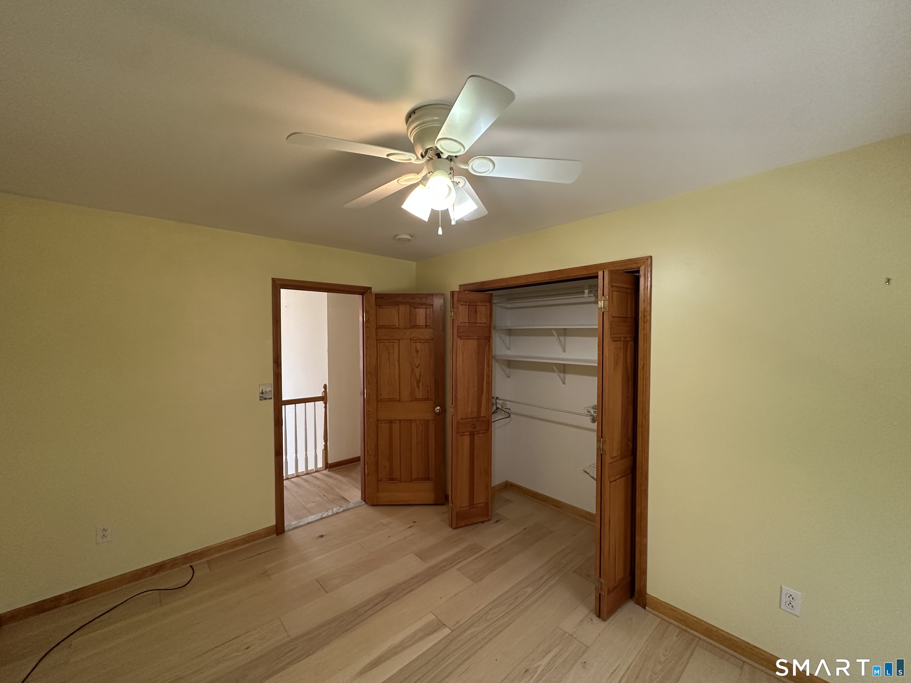 181 North Chestnut Hill Road Killingworth, CT 06419 - Photo 21 of 26 an empty room with a empty space and a ceiling fan