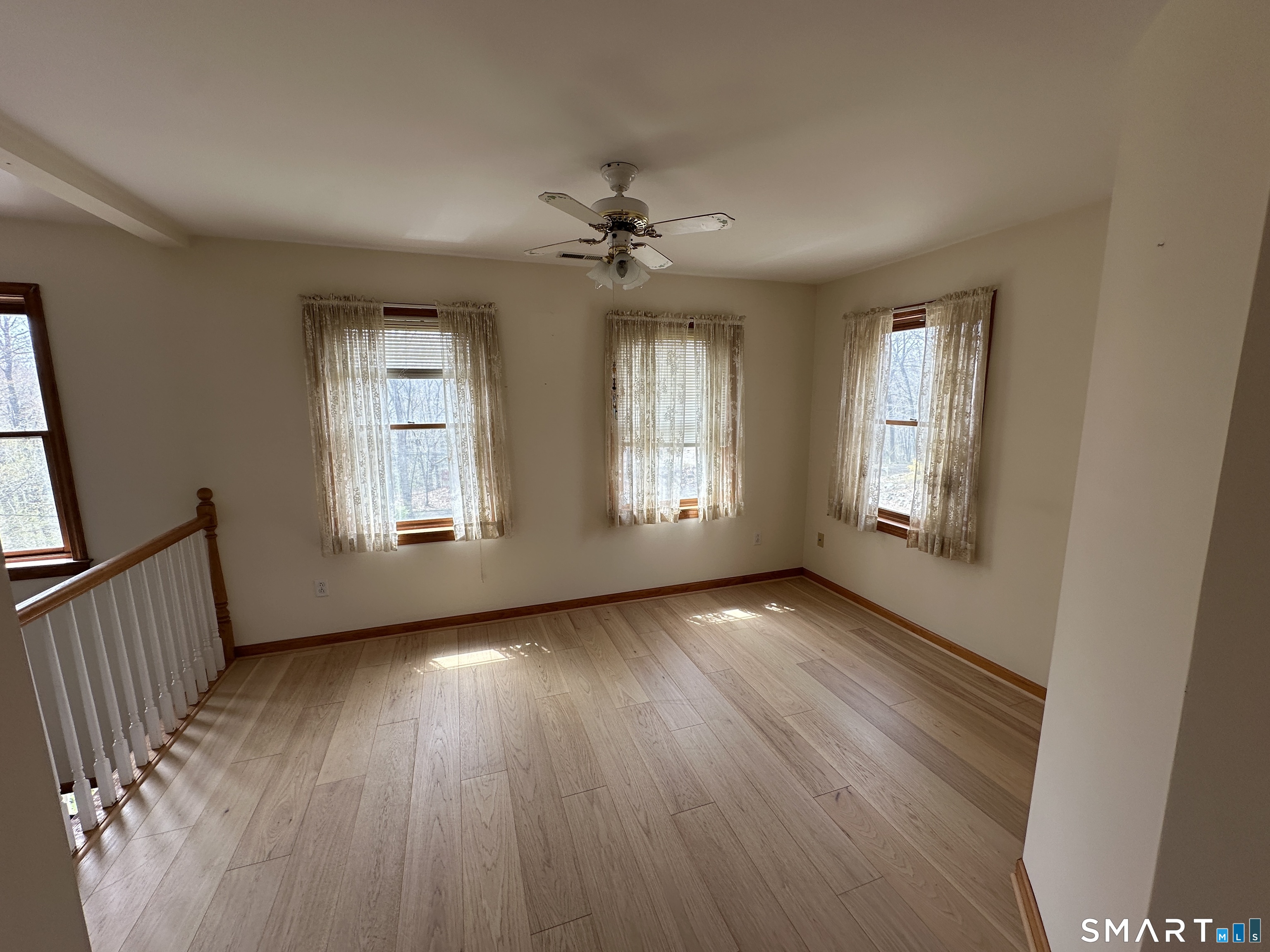181 North Chestnut Hill Road Killingworth, CT 06419 - Photo 25 of 26 a view of an empty room with wooden floor and a window