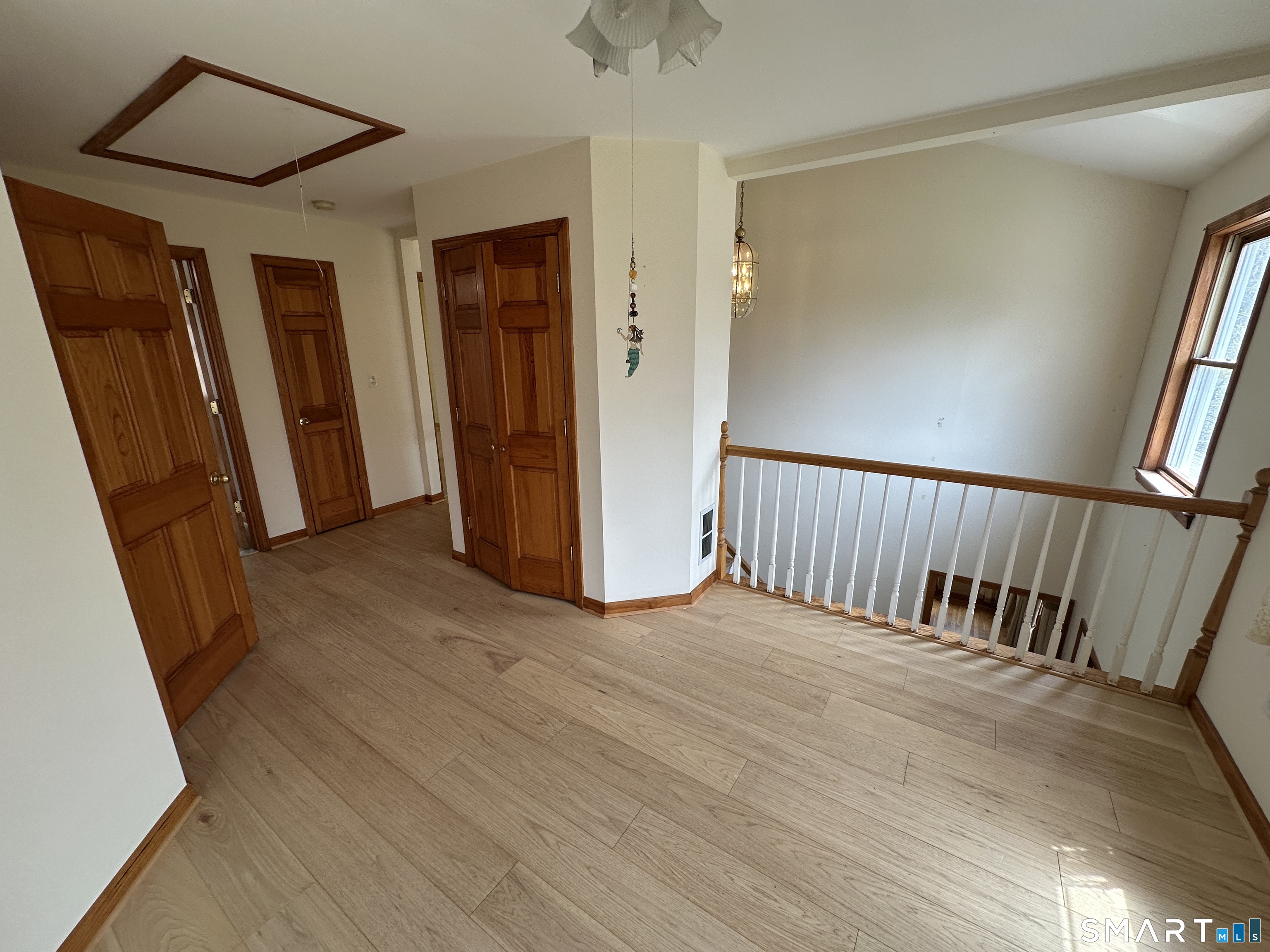 181 North Chestnut Hill Road Killingworth, CT 06419 - Photo 26 of 26 a view of a hallway with wooden floor and stairs