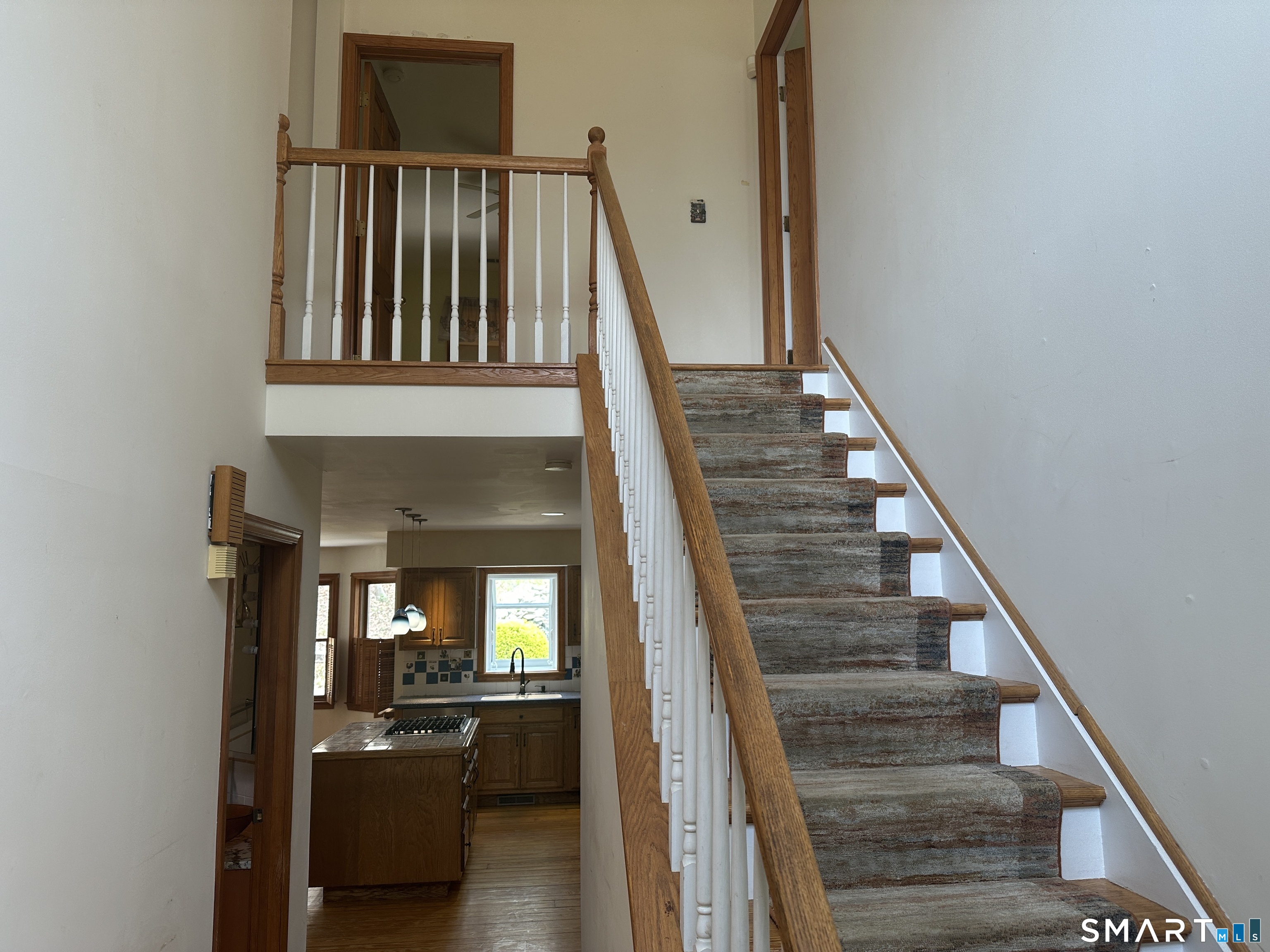181 North Chestnut Hill Road Killingworth, CT 06419 - Photo 10 of 26 a view of staircase with white walls and windows
