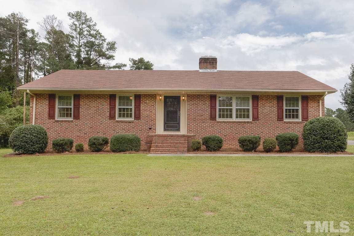 716 Sheriff Johnson Road Coats, NC 27521 - Photo 1 of 25 a front view of house with yard and green space
