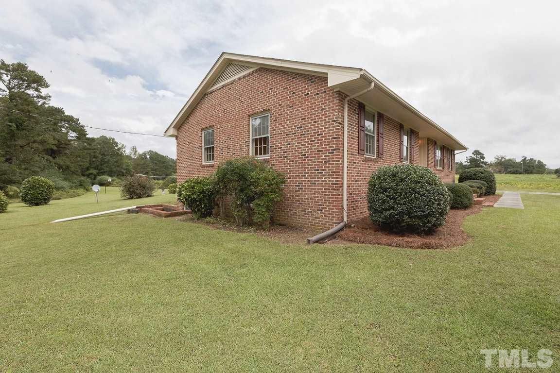 716 Sheriff Johnson Road Coats, NC 27521 - Photo 2 of 25 a view of a house with backyard and garden