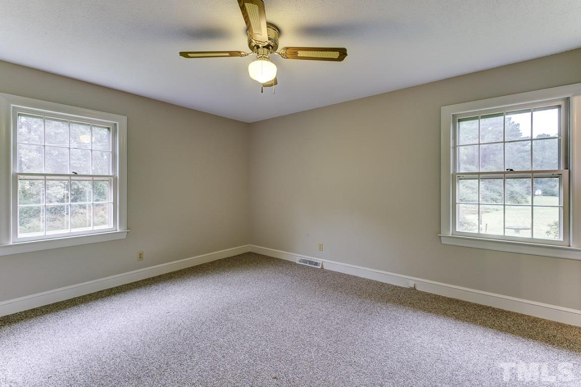 716 Sheriff Johnson Road Coats, NC 27521 - Photo 12 of 25 an empty room with a window
