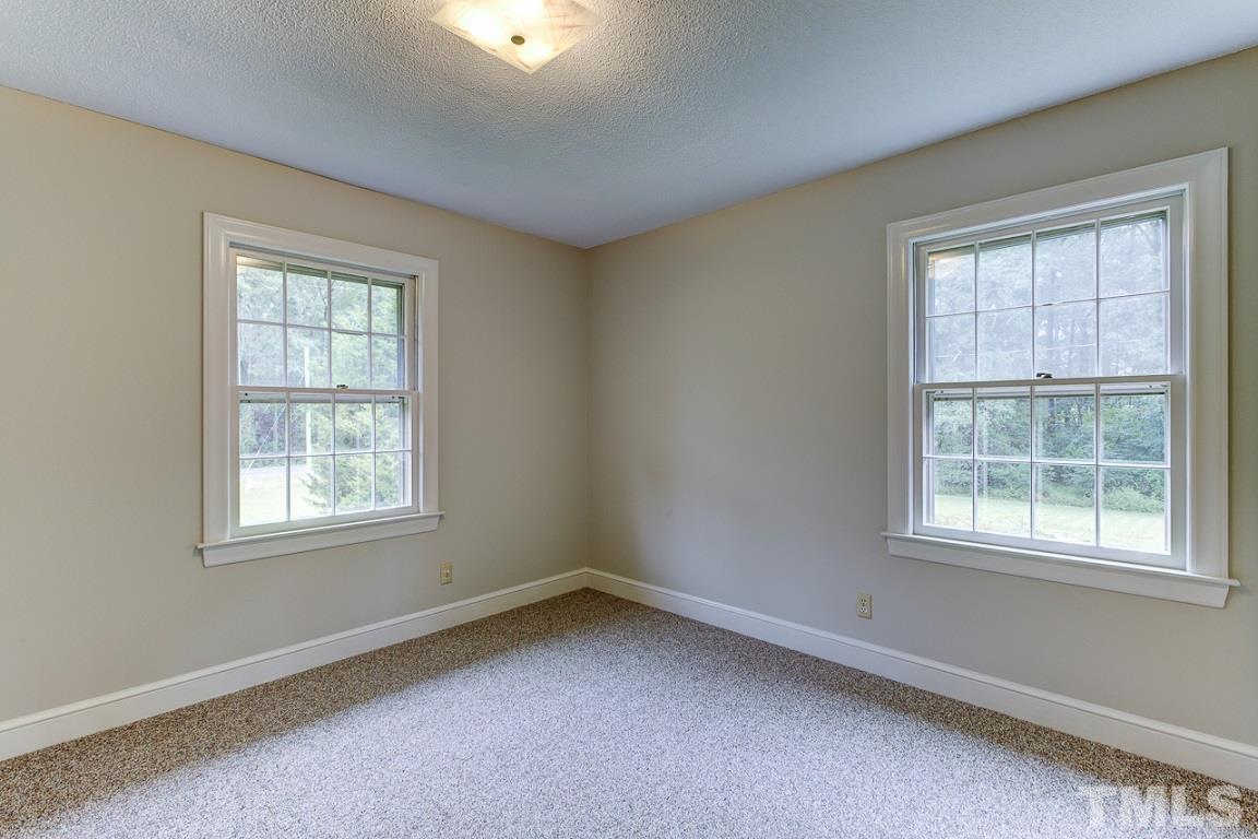 716 Sheriff Johnson Road Coats, NC 27521 - Photo 15 of 25 an empty room with a window