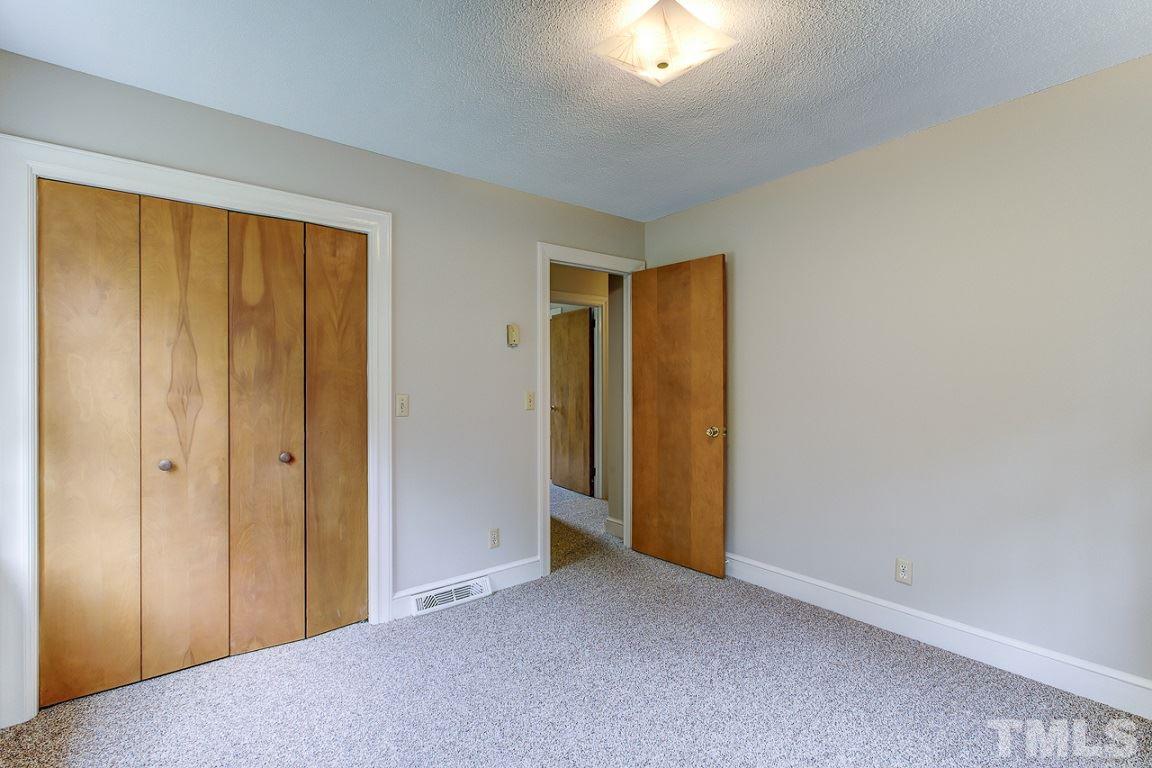 716 Sheriff Johnson Road Coats, NC 27521 - Photo 16 of 25 a view of an empty room and a window
