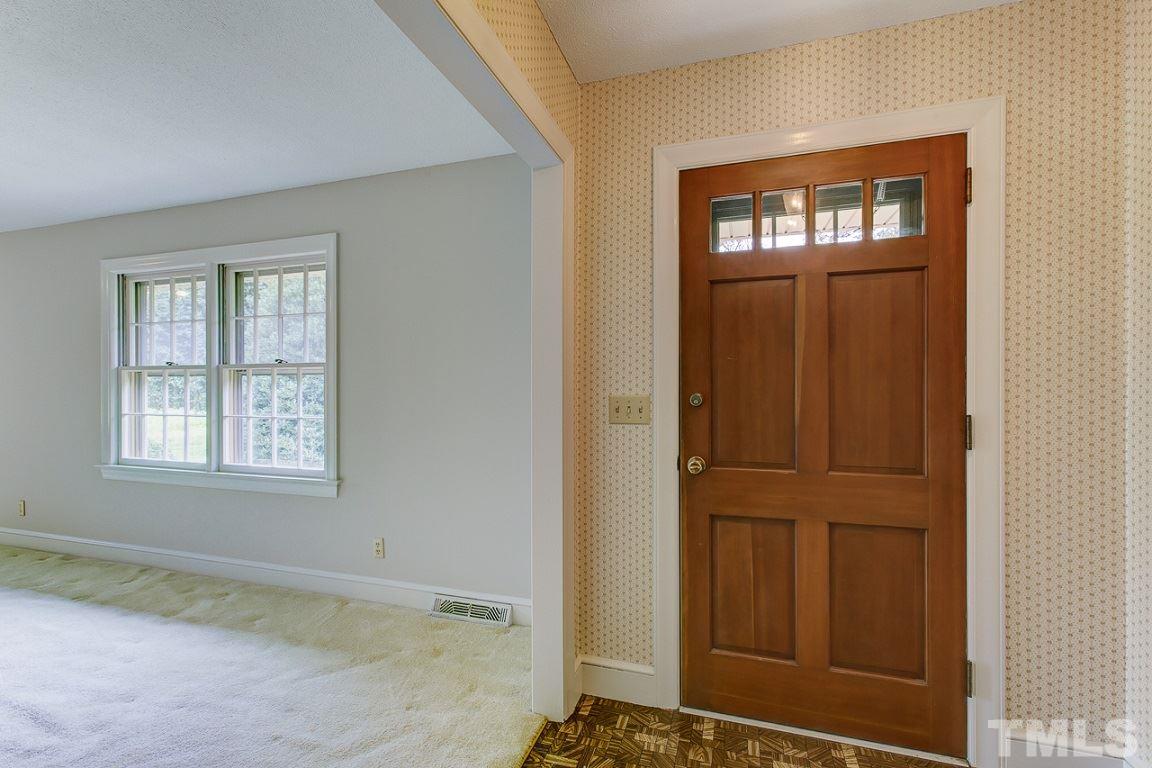 716 Sheriff Johnson Road Coats, NC 27521 - Photo 3 of 25 an empty room that has a window