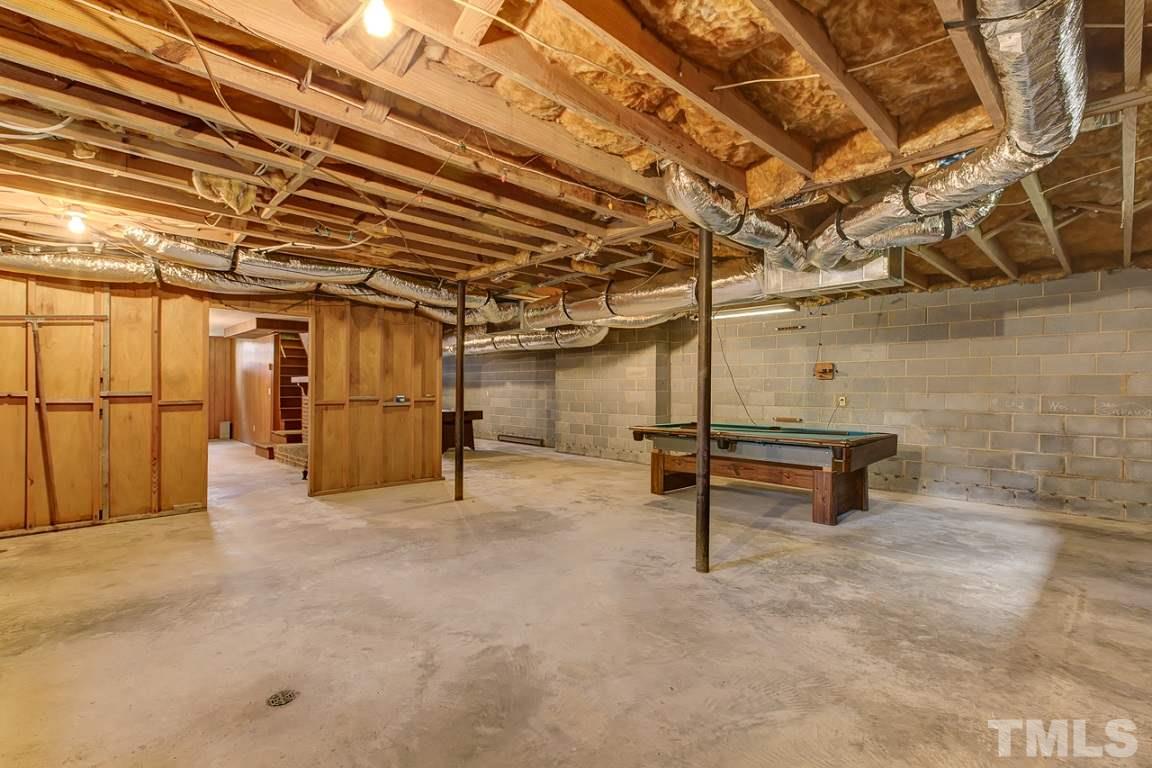 716 Sheriff Johnson Road Coats, NC 27521 - Photo 21 of 25 a view of a room with wooden walls