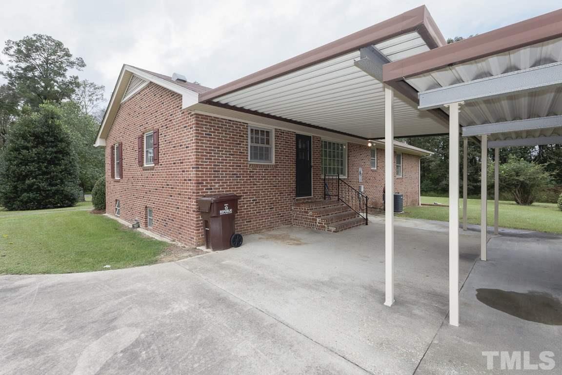 716 Sheriff Johnson Road Coats, NC 27521 - Photo 23 of 25 a view of a house with backyard and porch